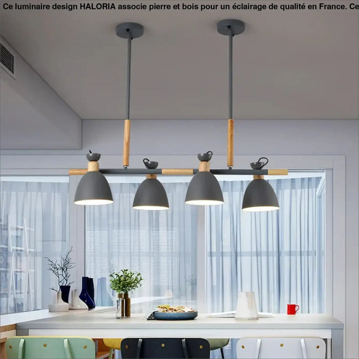 Luminaire design moderne en pierre et bois avec suspension grise au-dessus d’une table dans un coin salon haloria