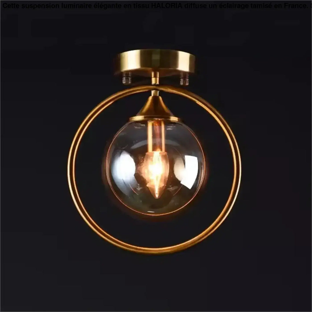 Luminaire plafonnier celliah en laiton avec globe en verre clair et ampoule à filament apparent