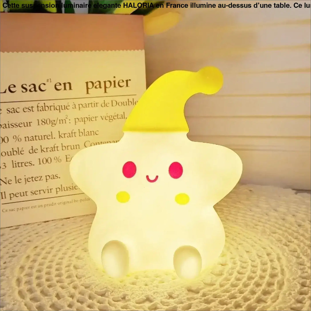 Veilleuse étoile starsy en forme d’étoile jaune douce avec visage souriant et chapeau pointu pour lumière douce et c’est offrir