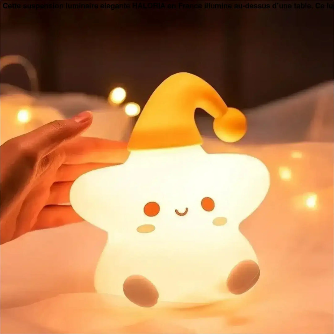Veilleuse étoile soft glowing with lumière douce and yellow santa hat c’est offrir a cozy nightlight by starsy
