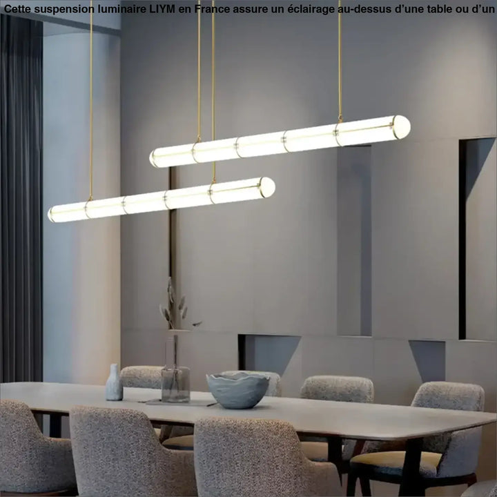 Suspension luminaire liym avec tubes en verre cylindriques et finitions métal doré idéale au-dessus d’une table ou d’un coin salon