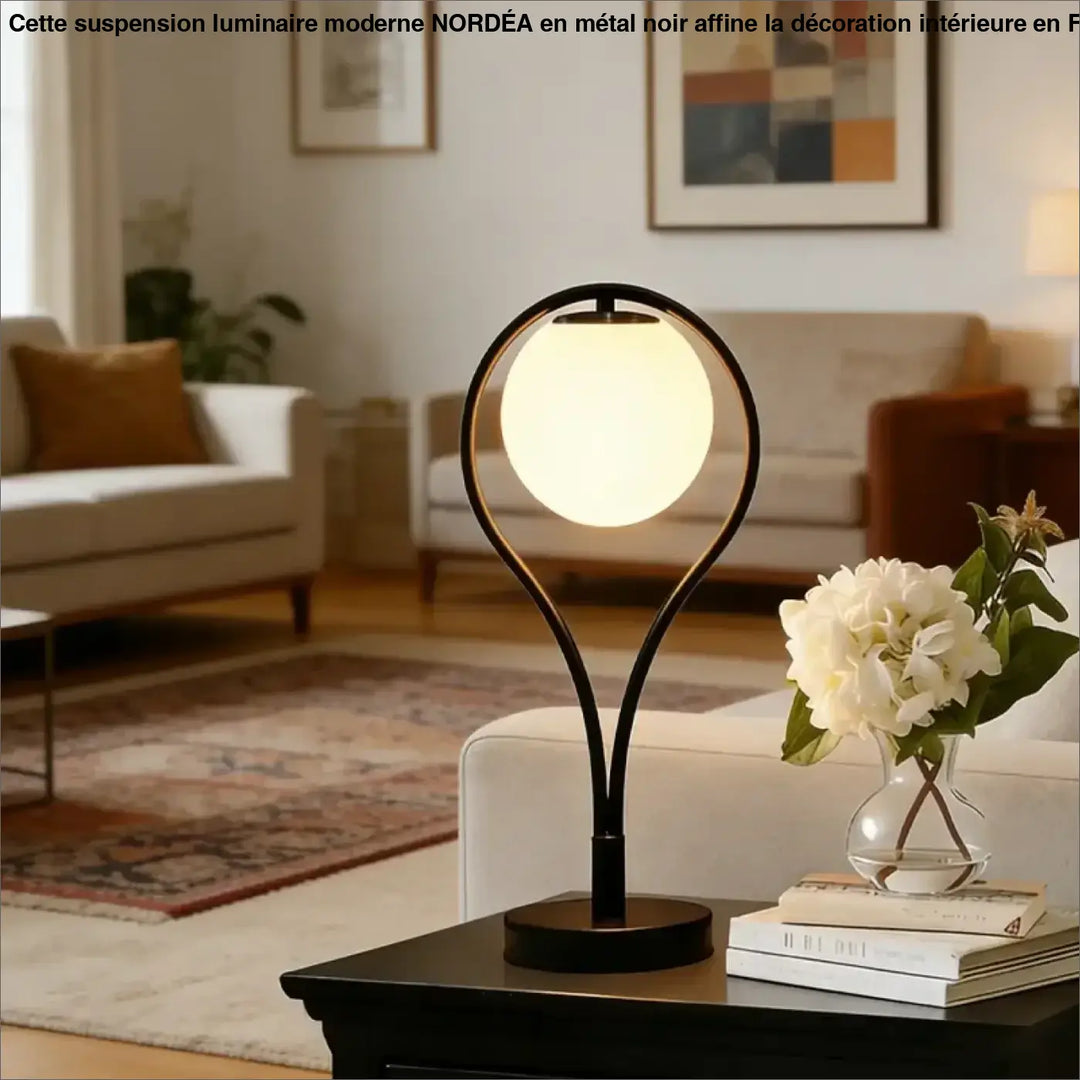 Lampe de table canila en métal noir avec un halo lumineux sphérique pour un chevet design et profiter d’un moment calme