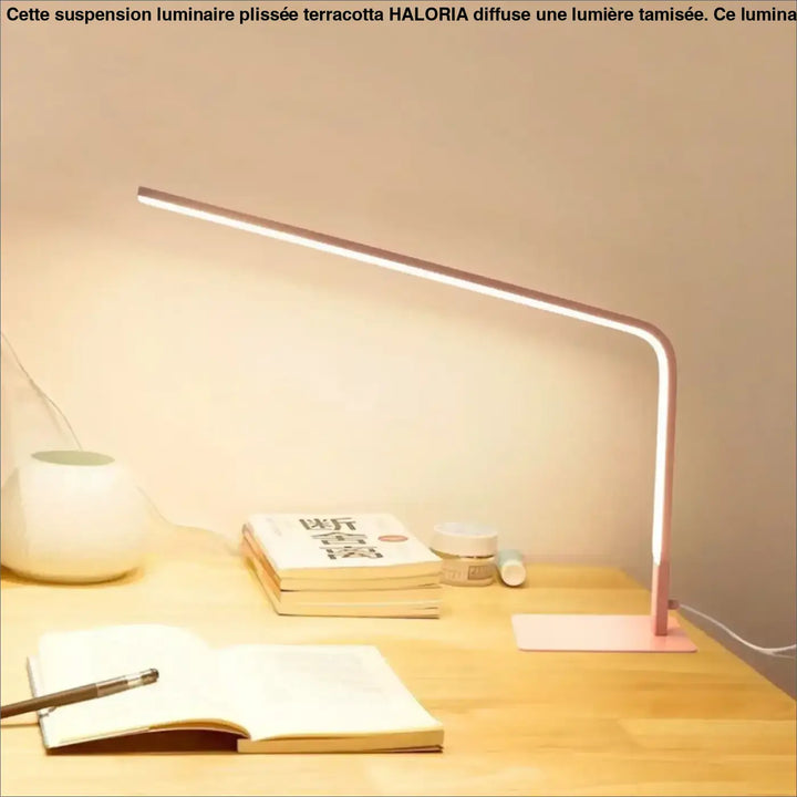 Lampe de table led contemporaine en rose gold avec design minimaliste et bras fin incurvé marque minini