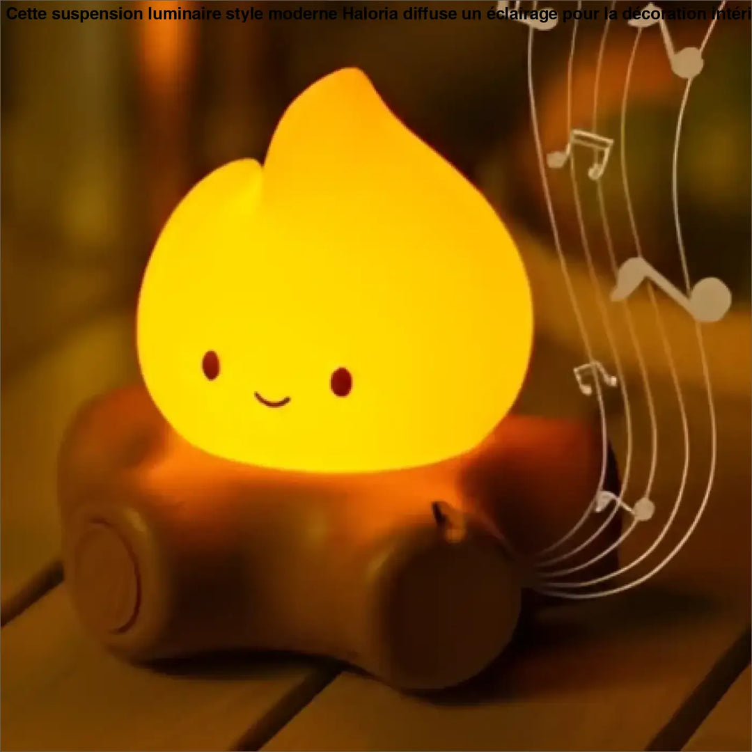 Veilleuse camp jaune en forme de caca souriant avec notes musicales pour une ambiance chaleureuse d’un feu cosy