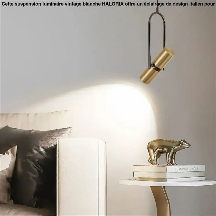Suspension luminaire sigo avec figurine ours en laiton brossé doré et spot orientable au design minimaliste