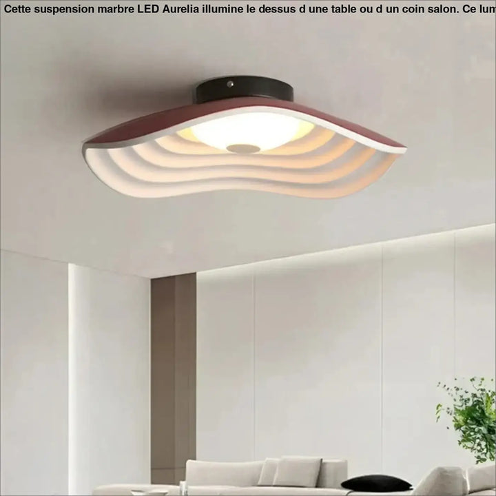 Suspension marbre led design elegant moderne au-dessus d’une table avec une finition blanche et bordeaux en couches