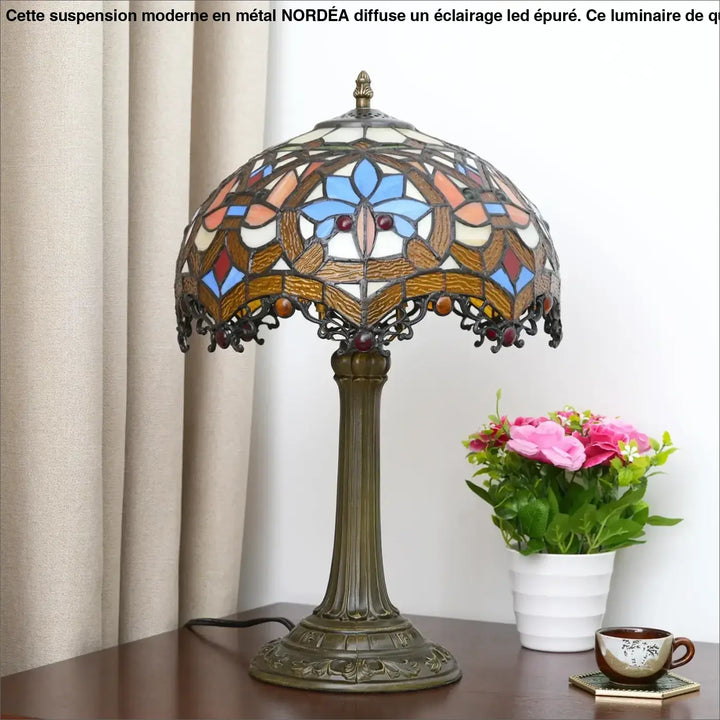 Lampe de table Nanih style vintage avec abat-jour en verre teinté bleu orange crème et base en bronze ornée