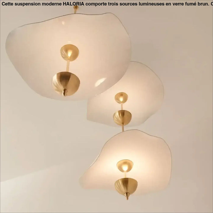 Suspension luminaire moderne dorée design aérien élégant