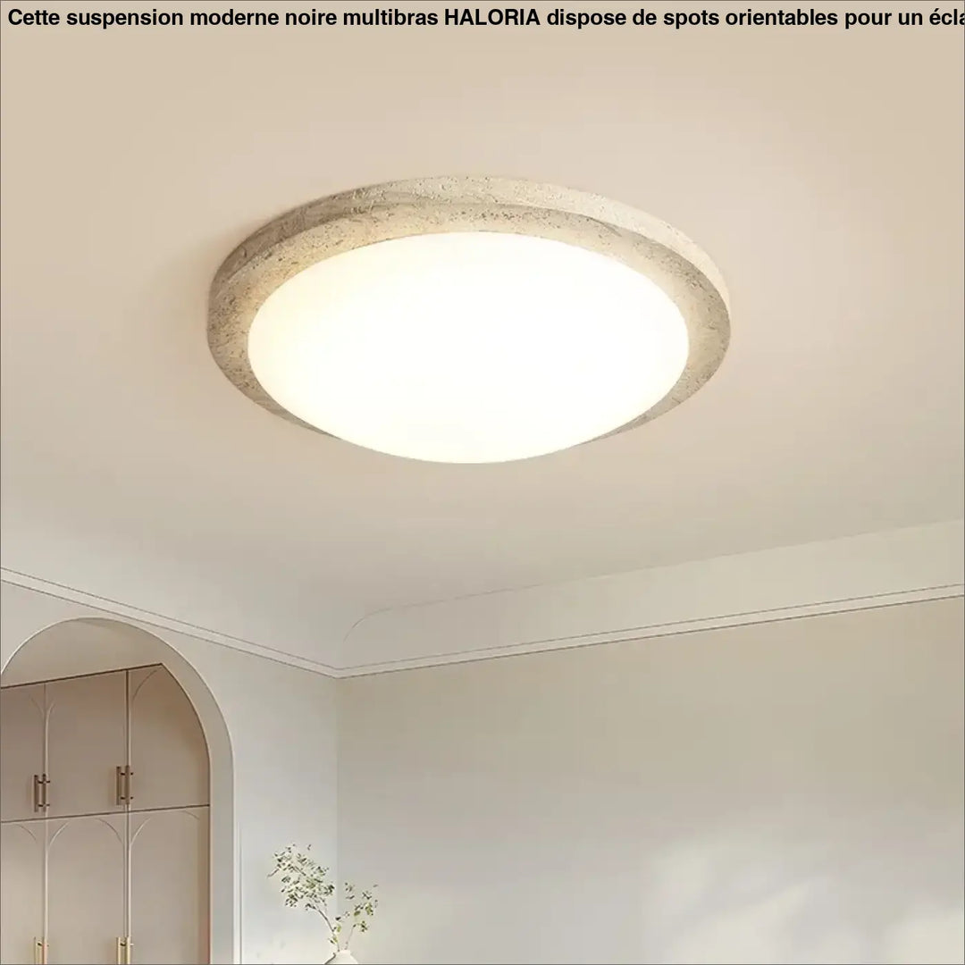Suspension moderne noire multibras avec cadre en béton texturé off-white et centre lumineux blanc éclatant