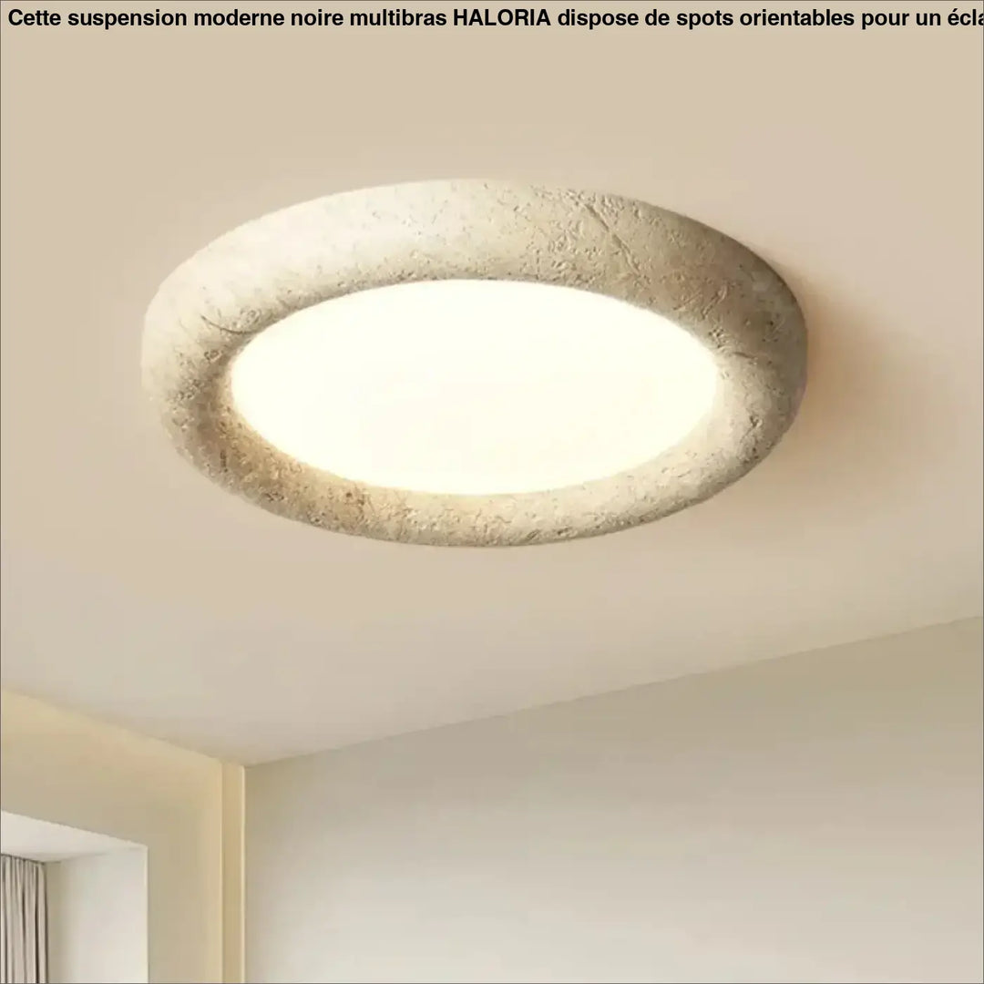 Circular ceiling light with textured beige stone frame and smooth white center for suspension moderne noire multibras by haloria