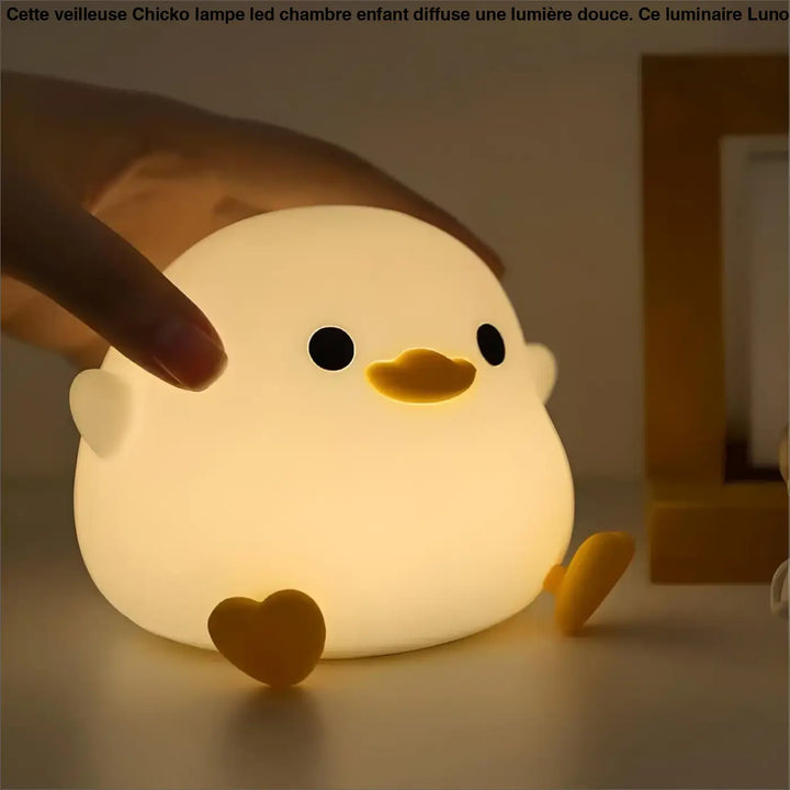 Veilleuse chicko lampe led chambre d’enfant en silicone blanc en forme de poussin avec yeux noirs et pieds en cœur orange