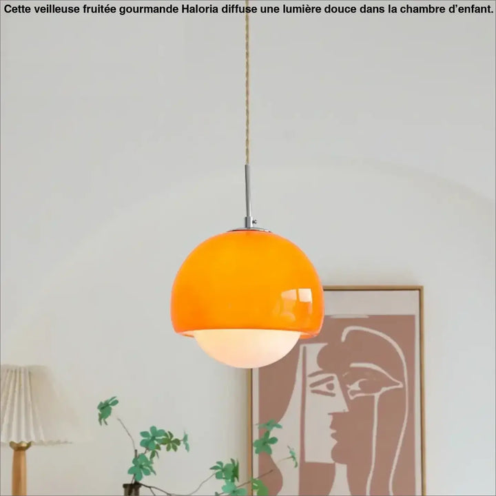Suspension luminaire orana en verre orange vibrant avec tige en chrome et corde tressée offrant une lumière douce boule minimaliste