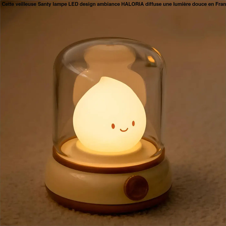 Veilleuse santy lampe led cream colorée en silicone en forme de goutte souriante sous dôme en verre avec base beige et marron